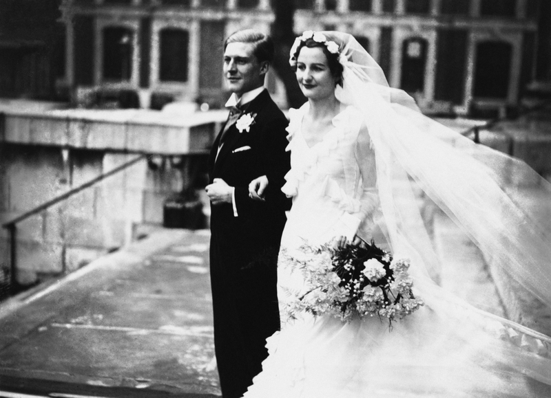 “English writer The Hon Nancy Mitford (1904 - 1973) and The Hon Peter Rodd (1904 - 1968) after their wedding at St John’s Church, Smith Square, London, 4th December 1933.” Photo via Getty Images.
